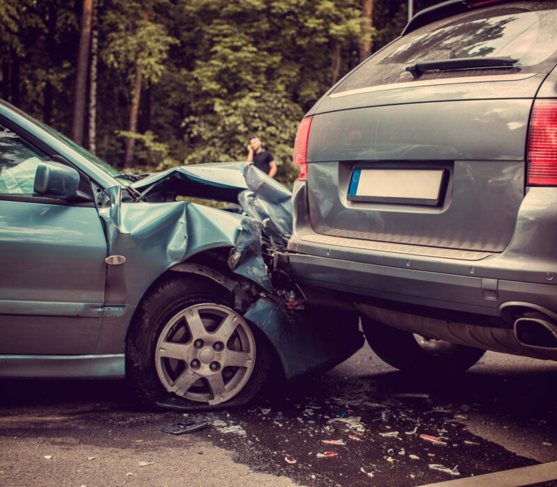 Close up smached cars on a road.